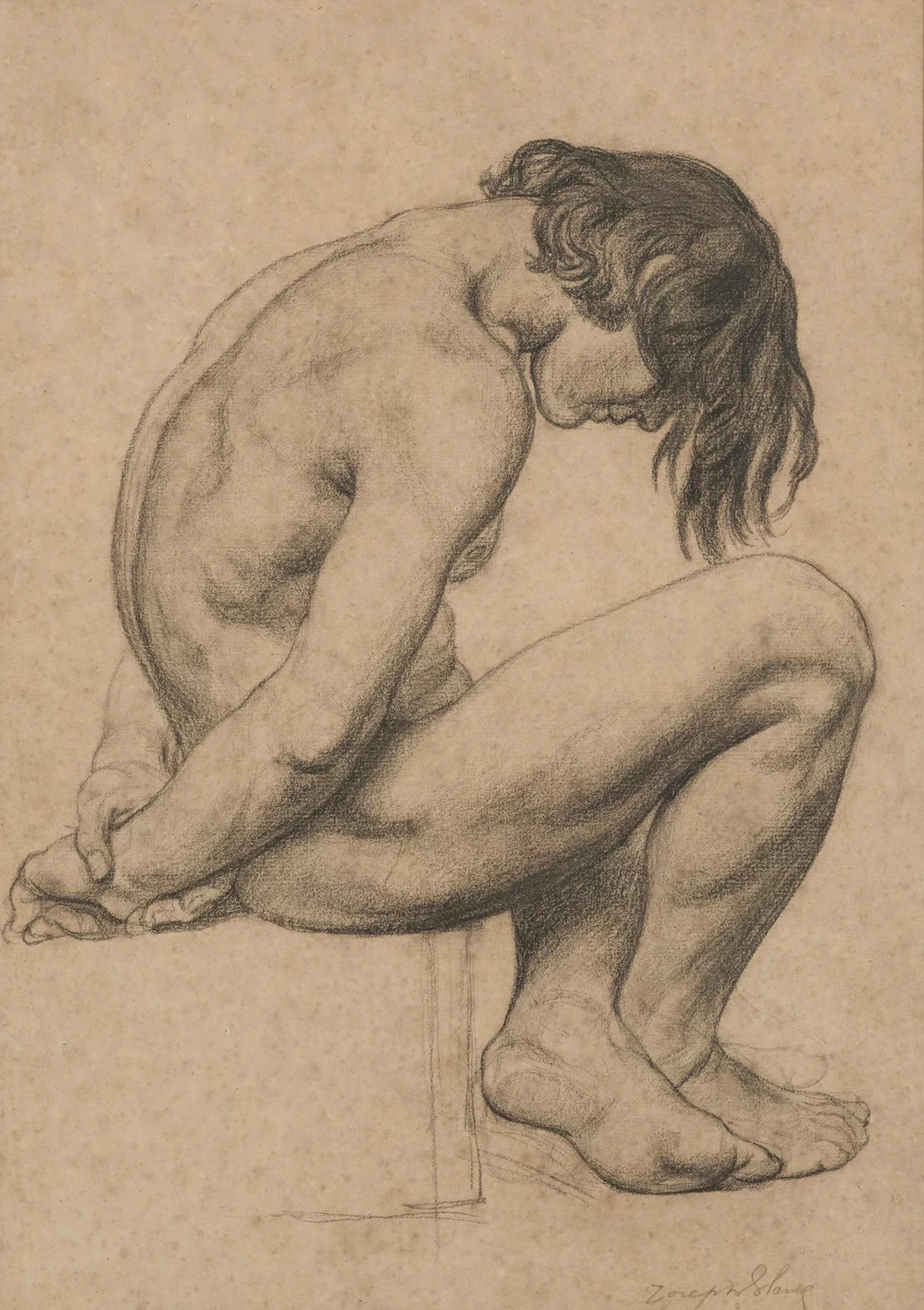 Giovane uomo nudo seduto